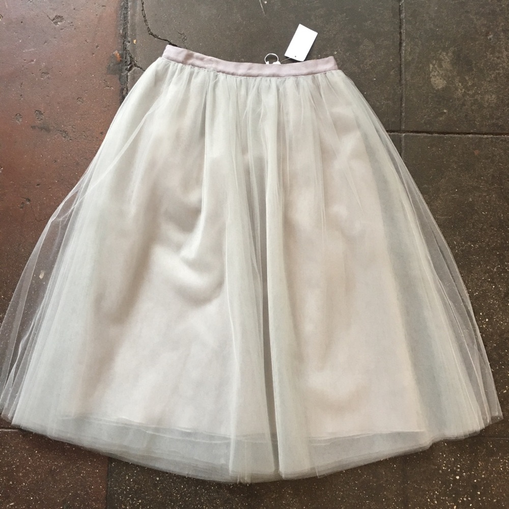 Gray tulle below-the-knee skirt.